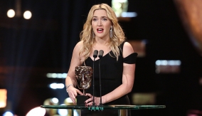Kate Winslet accepts her third BAFTA