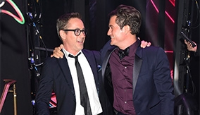 Bloom with Robert Downey Jr., who presented him with his award