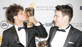 BAFTA Breakthrough Brit Daniel Gray kisses the award